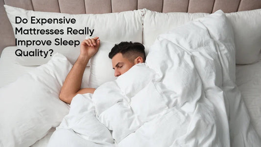 Man sleeping soundly in a bed completely covered by a large white duvet and surrounded by soft pillows, illustrating improved sleep.