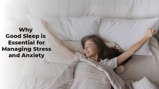 Good sleep for managing stress and anxiety: young woman waking up and stretching happily in a white, comfortable bed.