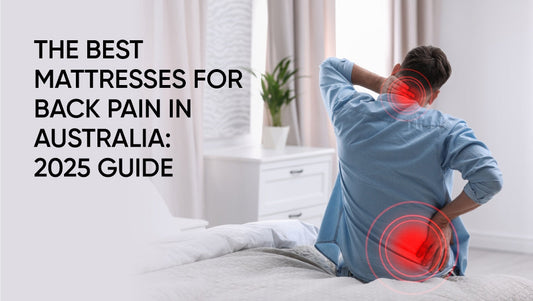 Man sitting on bed holding back in pain – best mattresses for back pain in Australia 2025