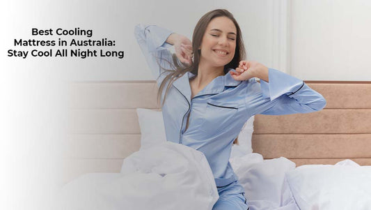 Woman stretching happily on a bed in silk pajamas, representing a cool and comfortable sleep with a cooling mattress