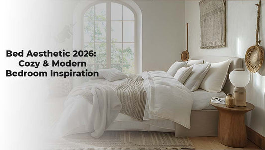 Cozy 2026 bed aesthetic featuring layered neutral blankets and a woven wicker light fixture