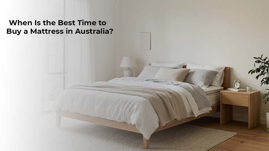 Modern bedroom featuring a wooden bed frame, white mattress and neutral bedding, illustrating the best time to buy a mattress in Australia.
