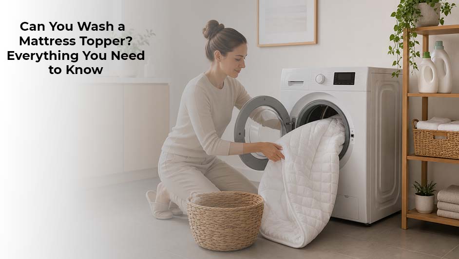 Woman placing a mattress topper into a washing machine for cleaning and maintenance 