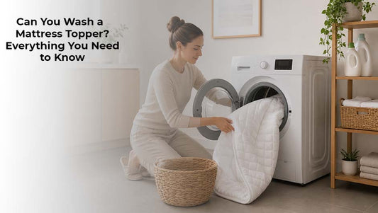 Woman placing a mattress topper into a washing machine for cleaning and maintenance 