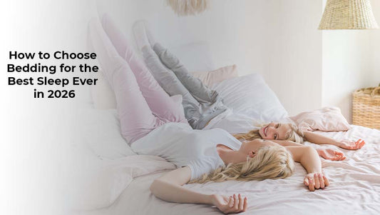 Two women relaxing on high-quality white bedding, illustrating how to choose the right sheets and pillows for better sleep in 2026.