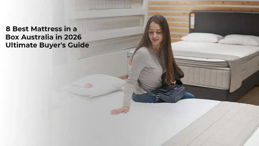 woman testing the comfort of a white premium mattress in a bedroom furniture showroom, with a mattress-in-a-box buyer's guide headline.
